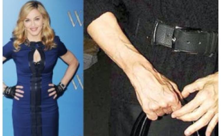Почему Мадонна прячет руки?